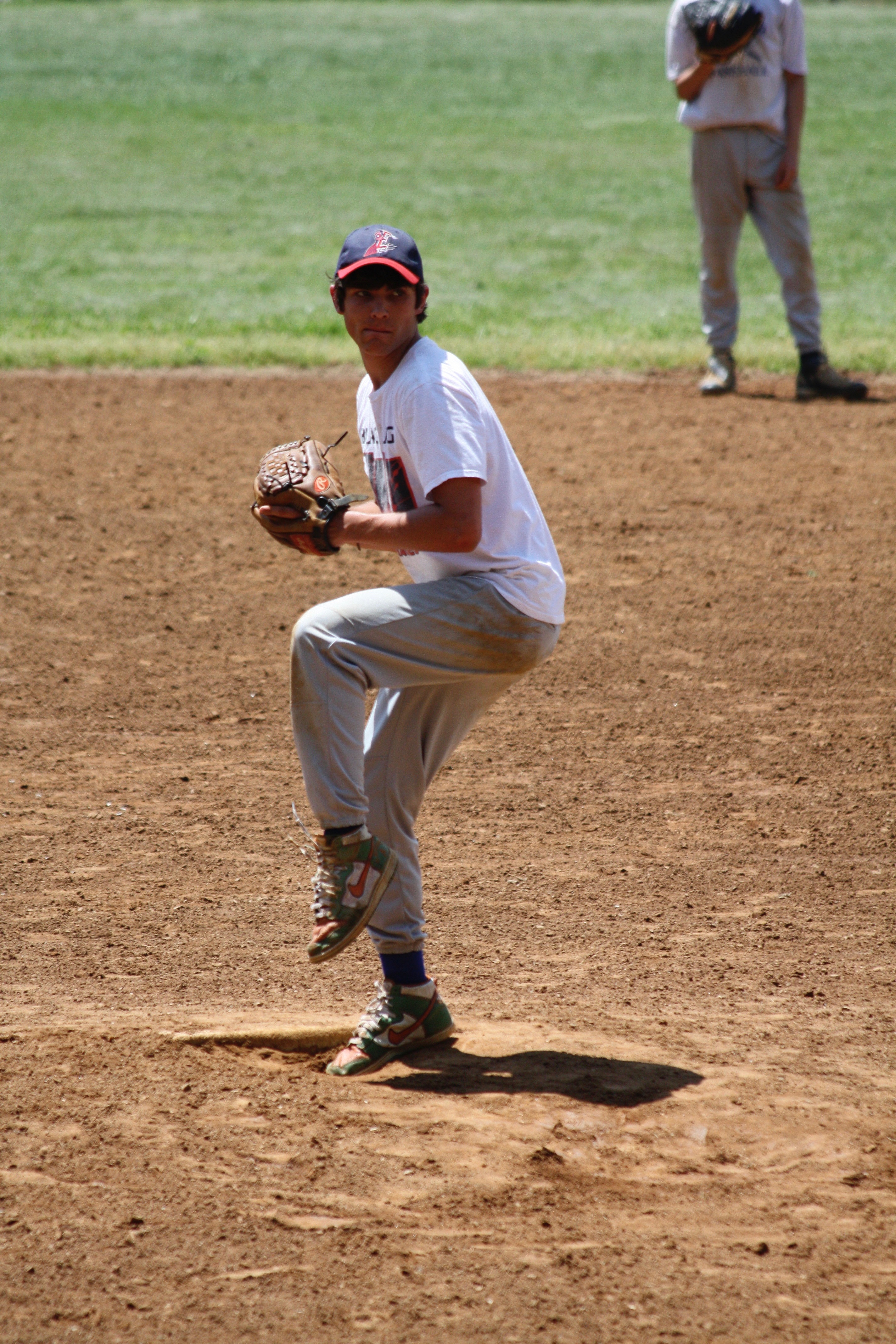 Coach Long pitching